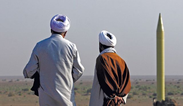 Men watching Iranian missile being launched 